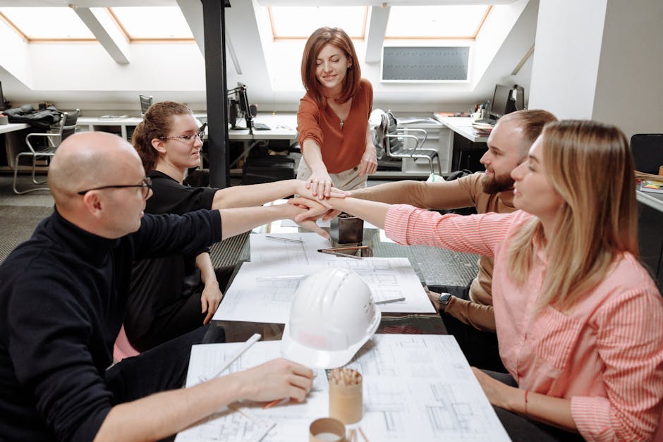 Architects collaborate on project plans in a modern office setting